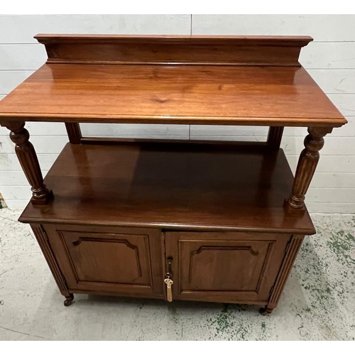 55 - A buffet sideboard with reeded arms and panelled doors on castors (H120cm W108cm D50cm)