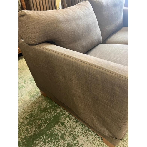 56 - A two seater brown sofa (H74cm W167cm D100cm)