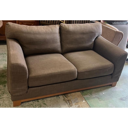 56 - A two seater brown sofa (H74cm W167cm D100cm)