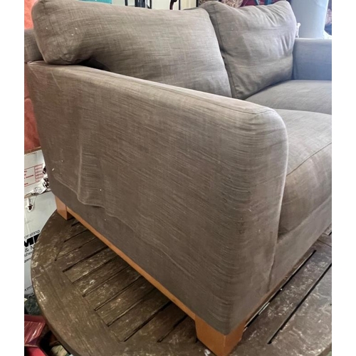 57 - A two seater brown sofa (H74cm W167cm D100cm)