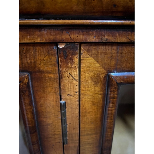 31 - Queen Anne revival style three door bookcase, rectangular top veneered with block moulding and a cus... 
