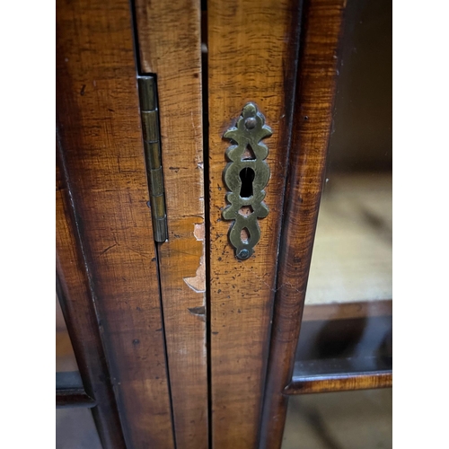31 - Queen Anne revival style three door bookcase, rectangular top veneered with block moulding and a cus... 