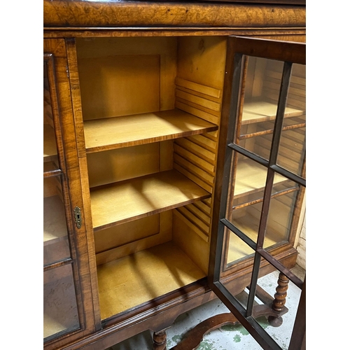 31 - Queen Anne revival style three door bookcase, rectangular top veneered with block moulding and a cus... 