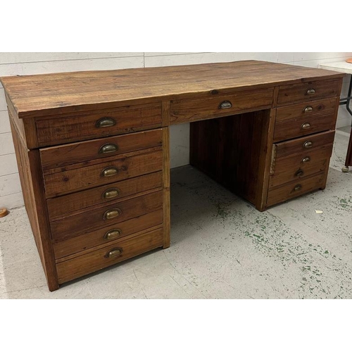 109 - A large distressed pine pedestal desk with three long drawers flanked by two, three drawer pedestals... 