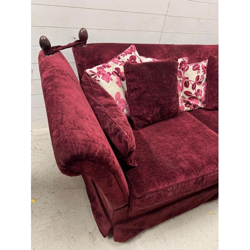 12 - A deep red velvet sofa with drop sides (H79cm W220cm D108cm)