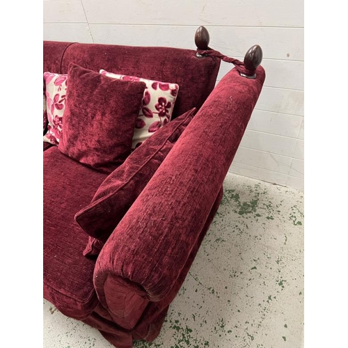 12 - A deep red velvet sofa with drop sides (H79cm W220cm D108cm)