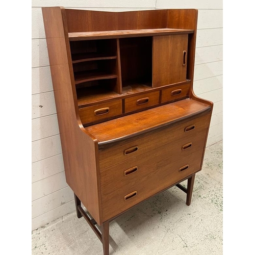 15 - Mid Century teak bureau desk, sliding door to front and three drawers under (H125cm W77cm D41cm)