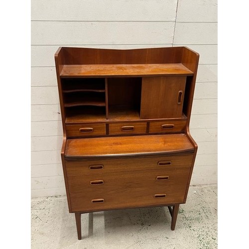 15 - Mid Century teak bureau desk, sliding door to front and three drawers under (H125cm W77cm D41cm)