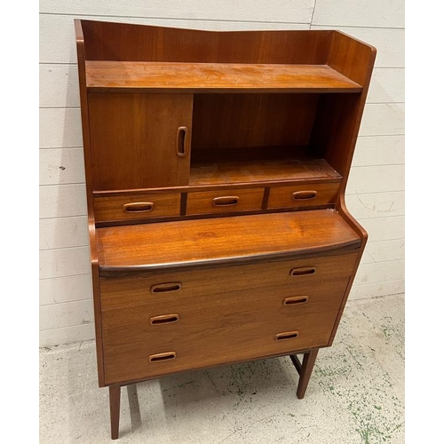 15 - Mid Century teak bureau desk, sliding door to front and three drawers under (H125cm W77cm D41cm)