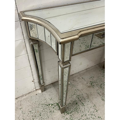 34 - A mirrored glass console table (H79cm W90cm D35cm)