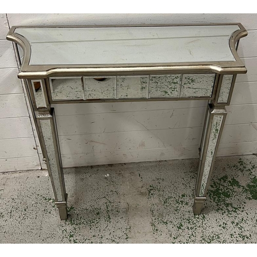 34 - A mirrored glass console table (H79cm W90cm D35cm)