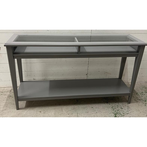 37 - An Ikea console table with glass top (H75cm W132cm D37cm)