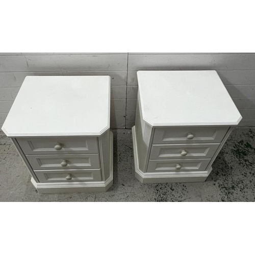 39 - A pair of white bedsides consisting of three drawers (H63cm W52cm D44cm)