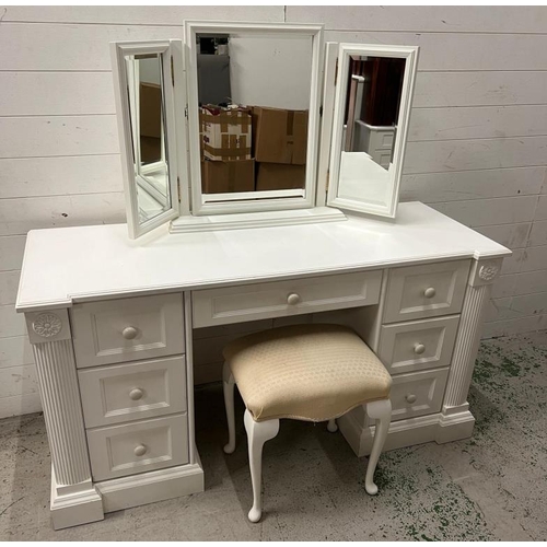 40 - A white dressing table flanked with drawers and mirror to top (H77cm W146cm D54cm)