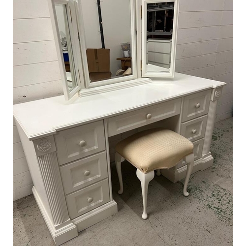 40 - A white dressing table flanked with drawers and mirror to top (H77cm W146cm D54cm)