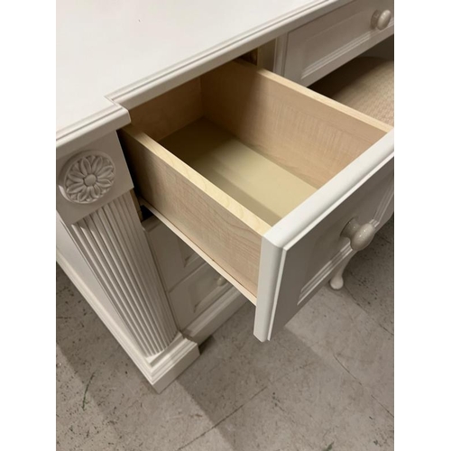 40 - A white dressing table flanked with drawers and mirror to top (H77cm W146cm D54cm)