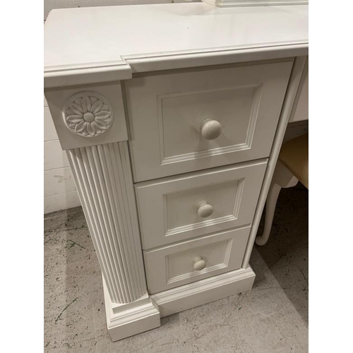 40 - A white dressing table flanked with drawers and mirror to top (H77cm W146cm D54cm)