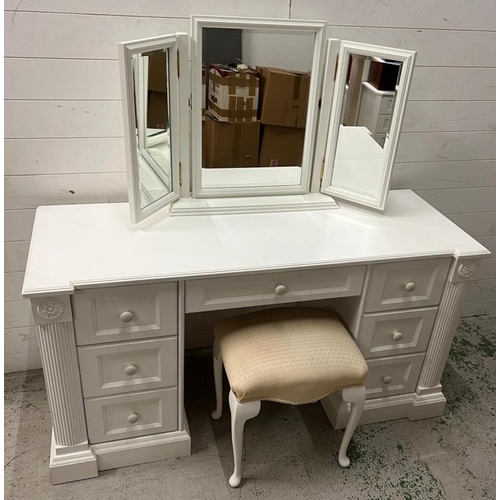 40 - A white dressing table flanked with drawers and mirror to top (H77cm W146cm D54cm)