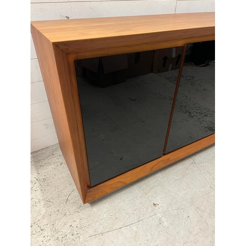 41 - A sideboard with three black glass panelled front (H80cm W152cm D45cm