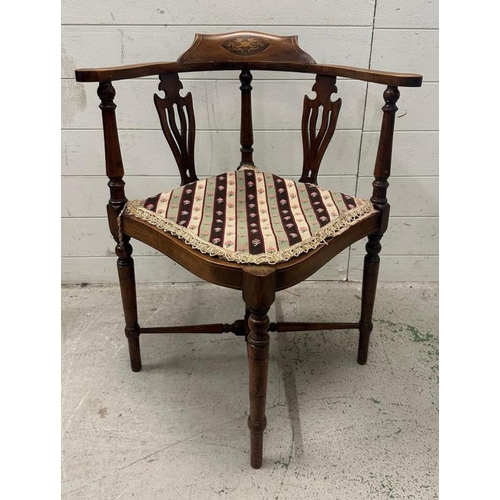 45 - An Edwardian inlaid corner chair upholstered in a floral pattern