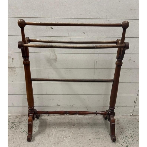 46 - A Mahogany towel rail with turned supports and stretcher on splayed legs