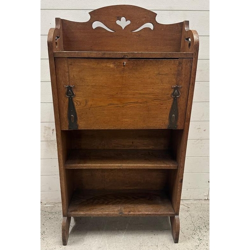 53 - An oak Arts and Crafts bureau bookcase with a galleried  top, the fall opening to Pigeon holes and s... 