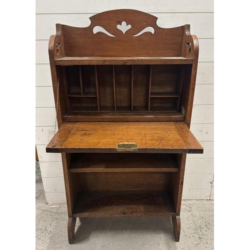 53 - An oak Arts and Crafts bureau bookcase with a galleried  top, the fall opening to Pigeon holes and s... 