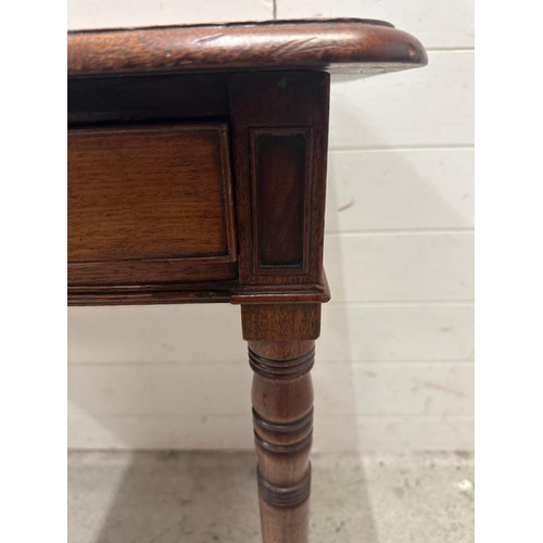 54 - A mahogany two drawer side table on turned legs and castors (H70cm W90cm D46cm)