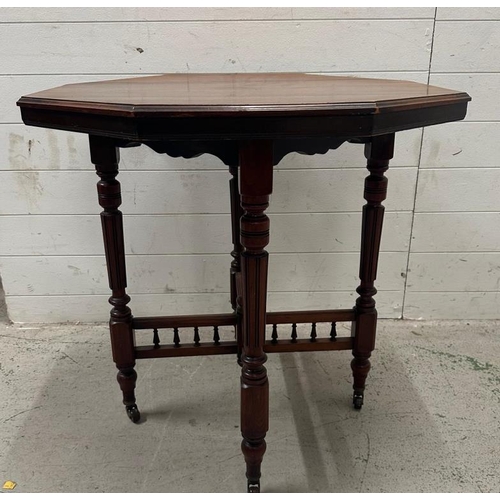 55 - An Edwardian style hexagonal occasional table on turned legs and castors (H75cm Dia76cm)