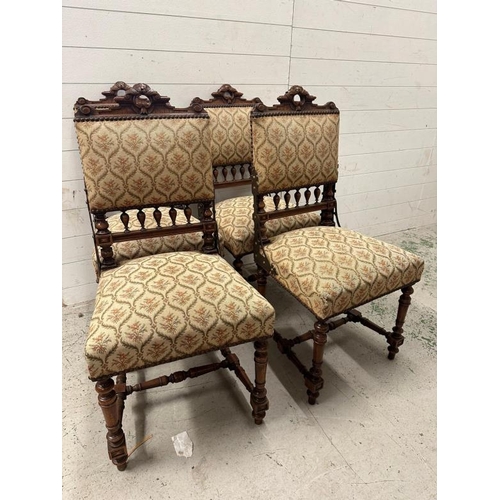 72 - A set of four oak French hall chairs with carved backs and turned legs and stretchers upholstered in... 