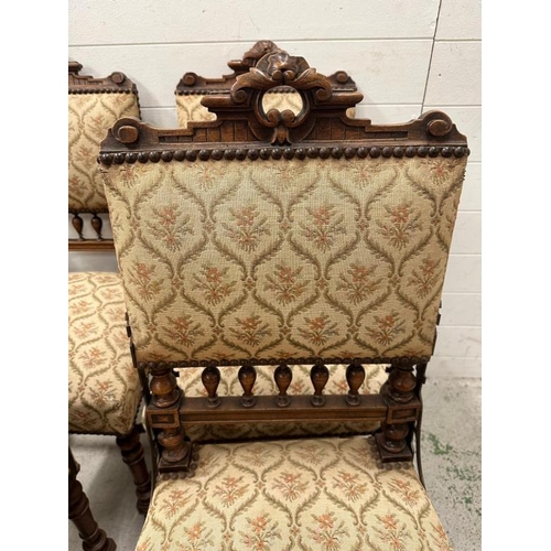 72 - A set of four oak French hall chairs with carved backs and turned legs and stretchers upholstered in... 