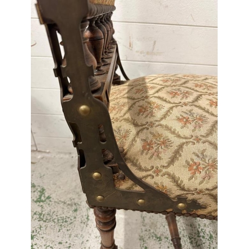 72 - A set of four oak French hall chairs with carved backs and turned legs and stretchers upholstered in... 