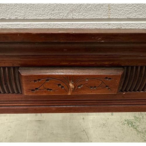 75 - A heavily carved oak coffer with three panels to front and central shield (H62cm W128cm D54cm)