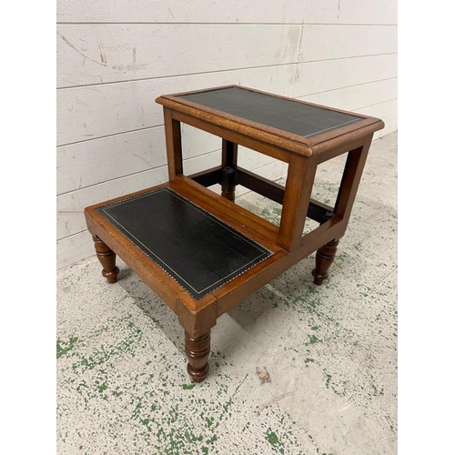 76 - A set of mahogany library steps with black leather treads on turned legs