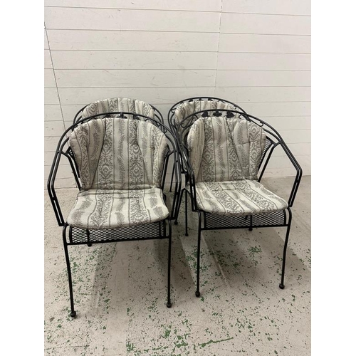 79 - A set of four black metal garden chairs with grey and silver upholstered cushions