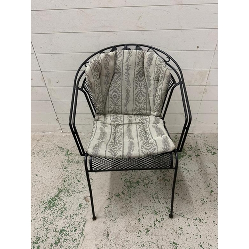 79 - A set of four black metal garden chairs with grey and silver upholstered cushions