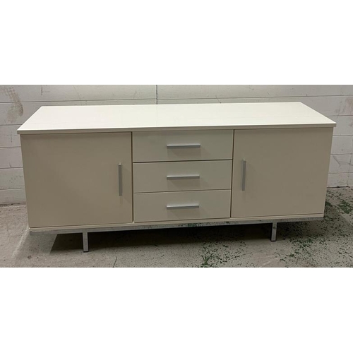 87 - A low white glass sideboard to centre and cupboards to sides (H60cm W140cm D40cm)