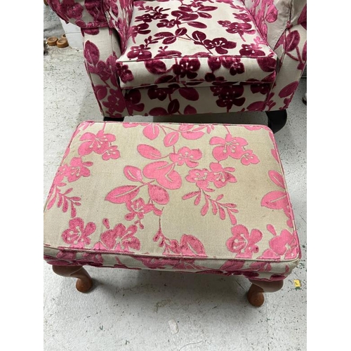 9 - A wing back arm chair upholstered in a floral pattern and an accompanying stool