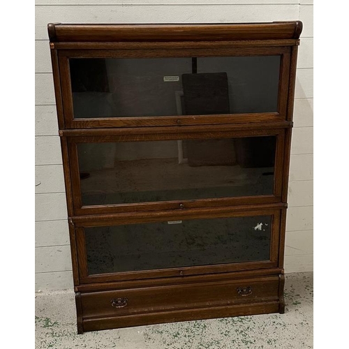 99 - A three tier globe Wernecke office cabinet with drawer under (H117cm W87cm D26cm)