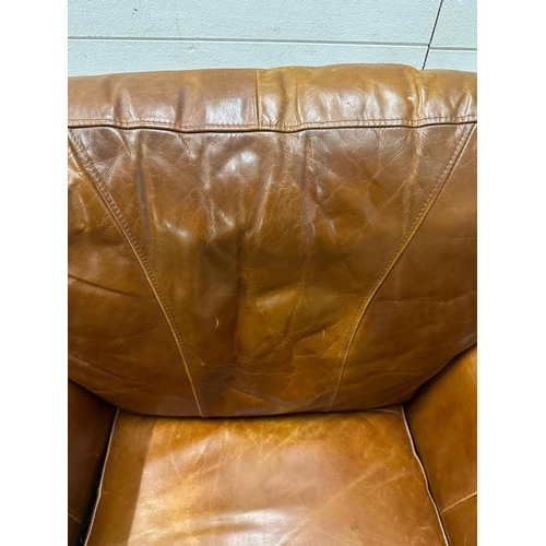 105 - A brown leather club arm chair