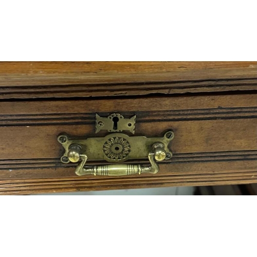 108 - An Edwardian style pedestal desk with one long central drawer flanked by four short drawers