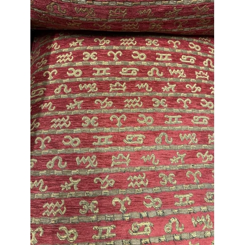 114 - A Duresta single armchair upholstered in a red and gold hieroglyphic pattern