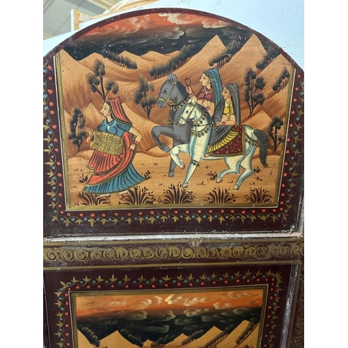 120 - A substantial Indian hardwood screen or room divider painted with rural Indian scenes featuring dign... 