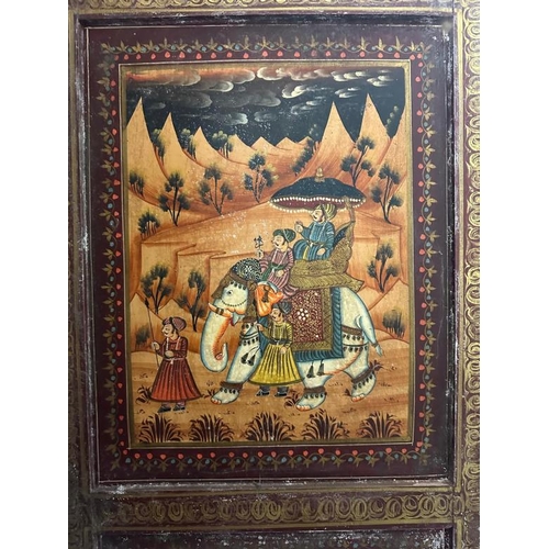 120 - A substantial Indian hardwood screen or room divider painted with rural Indian scenes featuring dign... 