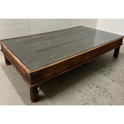 121 - A reclaimed Indian door converted into a coffee table (H46cm W203cm D116cm)