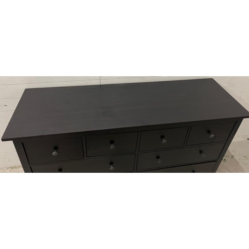 134 - An Ikea Hemnes chest of drawers in black (H96cm W160cm D50cm)