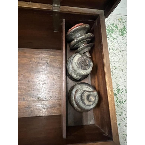 140 - An Indian teak coffer with panelled front and drawers under (H60cm W130cm D60cm)