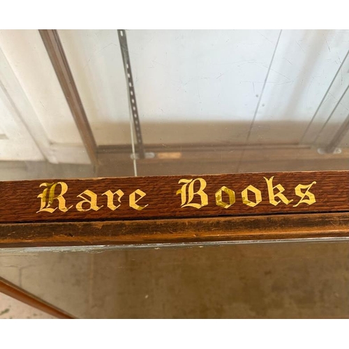 143 - A vintage haberdashery glass cabinet, classic shop counter with glass sliding doors and internal bra... 