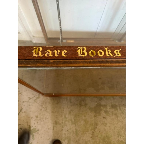 143 - A vintage haberdashery glass cabinet, classic shop counter with glass sliding doors and internal bra... 