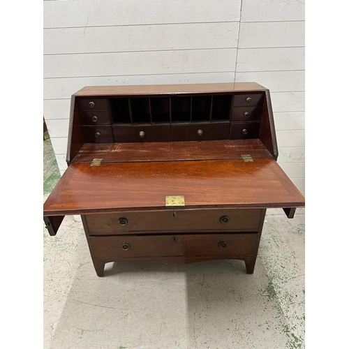 147 - A mahogany four drawer bureau, the fall opening to drawers and storage (H107cm W99cm D48cm)